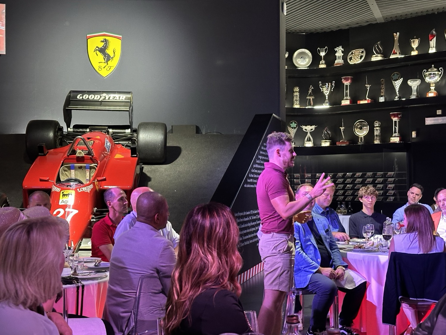 Lewis Hunter speaking to a seated audience at the Ferrari Museum