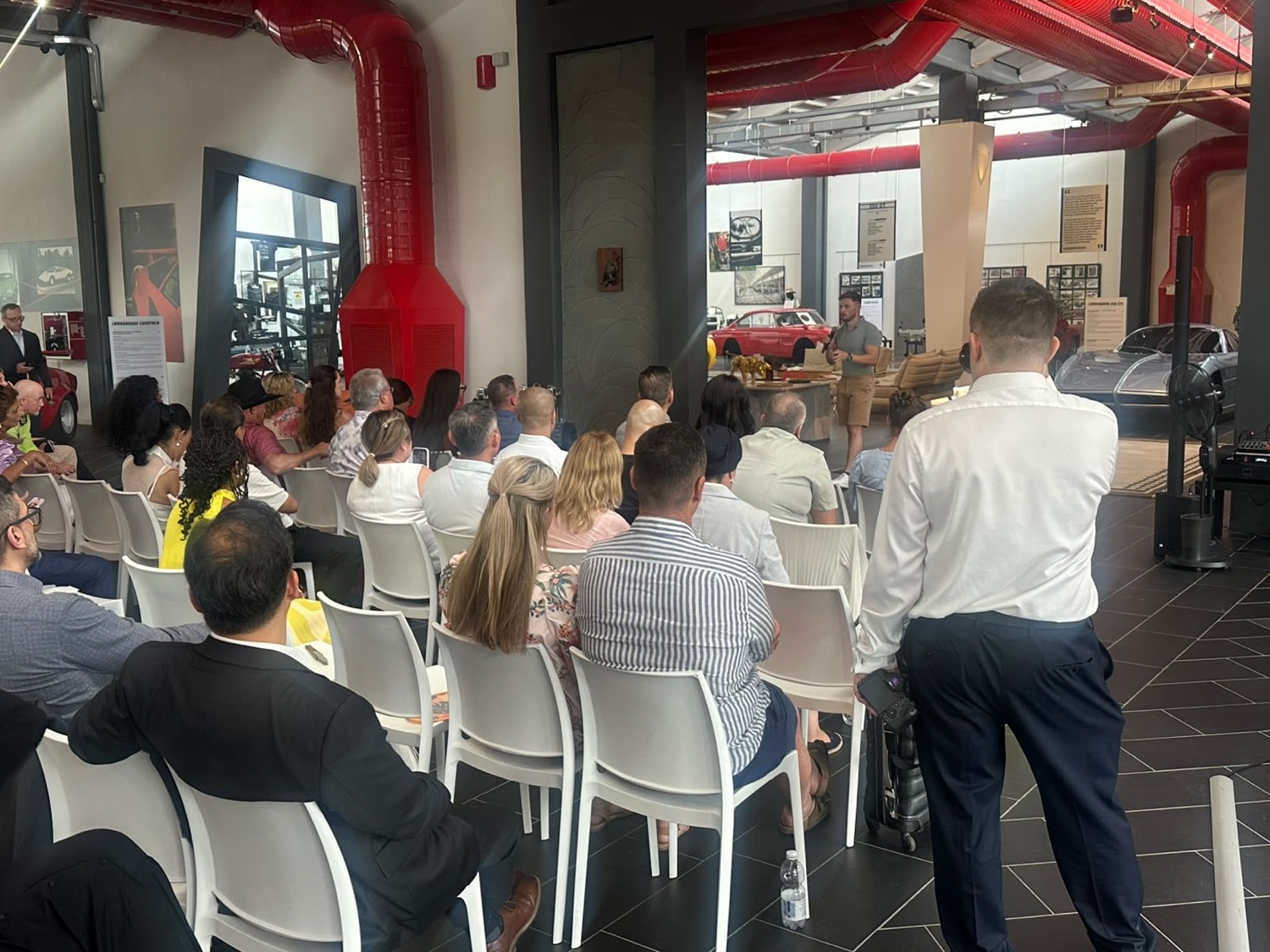 Lewis Hunter speaking to a full room at the Lamborghini Museum